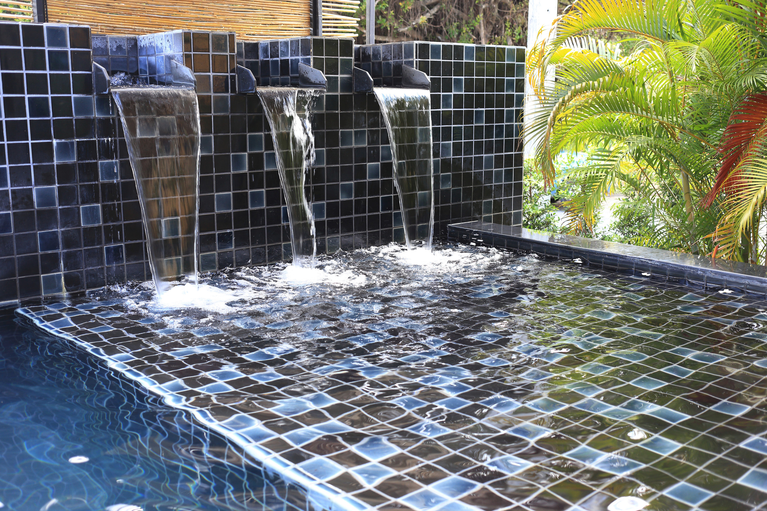 flowing water decorated in swimming pool